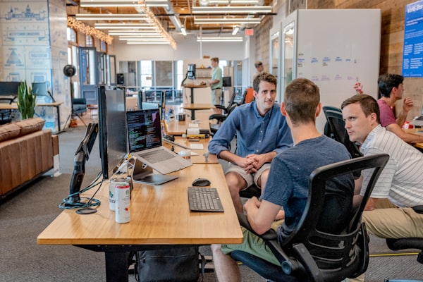 Engineers in discussion focused on client outcomes